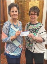 Modern Home Club’s Soundra Christy, right, presents a $300 donation to Childress County Christmas Sharing Board Member Raenell Smith. Courtesy Photos