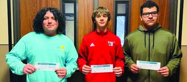 Wellington High School students Benji Garcia, left, Logan Marshall, Kris Valdez and Aison Skelton (not pictured) accept lunch gift certificates, complements of Angel’s Subs &amp;amp; Sweets and Brother-Sisters of Our Military (BOOM) Adventures, in a recent Friday drawing.