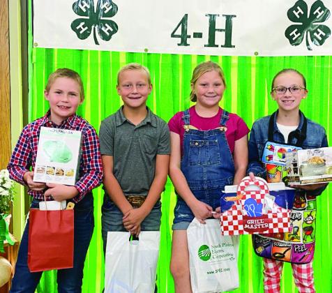 From left: Kolt Whitaker, second place; Gunner Pierce; Emma Moore; Miranda Henry, first place.