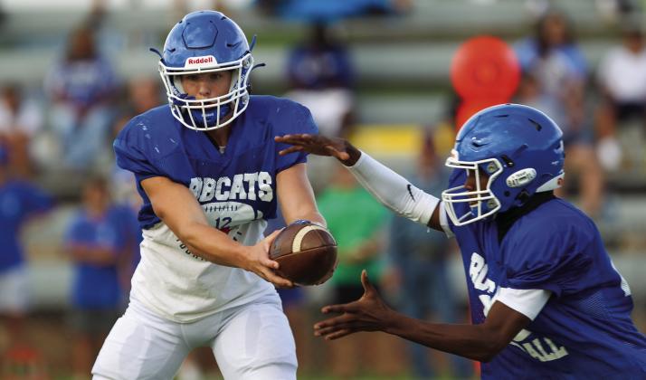 Childress’ Seth Taylor hands the ball off to Kobe Sims during the Bobcat’s scrimmage against the Clarendon Broncos Friday, Aug. 19. Next, the Bobcats kickoff the official season Friday, Aug. 26 against the Abernathy Antelopes at Antelope Stadium. For additional photos, see 2B. The Red River Sun/Nicole Dill