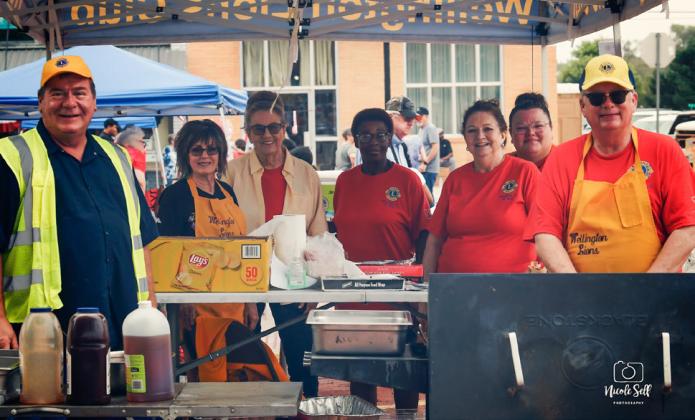 Wellington Lions prepare to sell pulled pork sandwiches and homemade ice cream during the Saturday, July 5 Wild &amp;amp; Free on 83 festivities on the Collingsworth County Courthouse lawn. From left, Dave Hall, Bev Odom, Sharon Starkey, Vernita Randon, Margret Wood, Lindsay Hill, Neal Odom. Nicole Self Photography