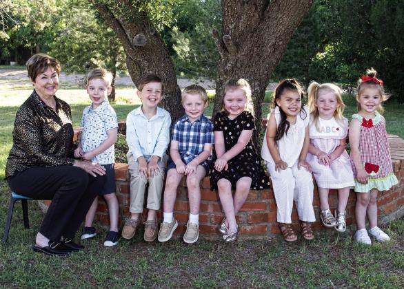 Three-year-old 2025 Tiny Texan Preschool graduates. From left: Director Carol Freeman, Colter Wellborn, Michael Morris, Luke Lemons, Charla Hagar, Kennedi Maldonado, Ellery Allred and Hartlee Stratton. Statham Photography
