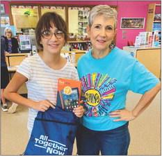 Wellington Junior High School sixth-grader Emma Zaragoza, left, accepts the grand prize Kindle for the Teen Summer Reading drawing at Collingsworth Public Library. Librarian Vicki Decker congratulates Zaragoza. Courtesy Photo