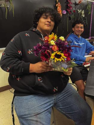 Floral design students upcycle tin cans