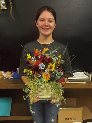 Memphis High School floral design students upcycle tin cans into fall door hangers, which students took home to a person of their choice. Memphis High School thanks donators for silk flowers, as well as the gallon tin cans, used during the project. Photos Courtesy of Memphis ISD