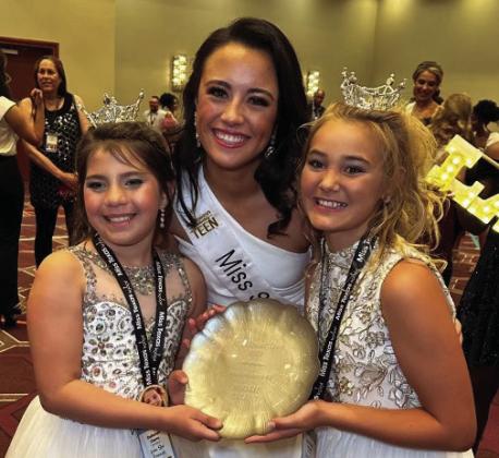 Summer Owens gathers with her Lone Star Princesses, Callahan Cantu, left, and Ava Kate Inman.