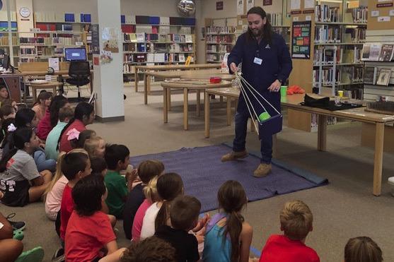 Students watch in awe as Tyler from Harrington Discovery Center makes science come alive in his Tuesday, June 20 presentation. All programs are free for Collingsworth Public Library’s “All Together Now” Summer Reading Program. Courtesy Photo
