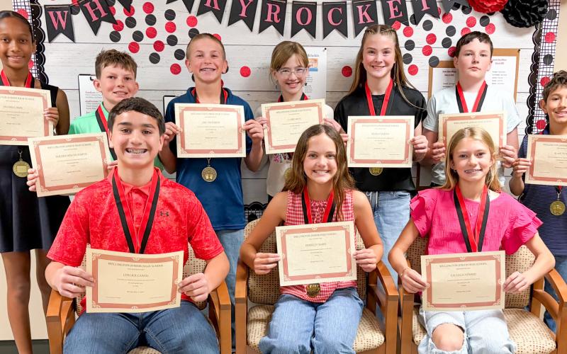 Wellington Junior High School sixth-grade Top 10 students accept accolades. Front row, from left: Collier Cantu, first; Berkeley Ward, second; Calleigh Henard, third. Back row, from left: Jaedah Casas, fourth; Holden Wischkaemper, fifth; Jake Anderson, sixth; Claire Mock, seventh; Kenlea Martin, eighth; Jacob Page, ninth; David Peters, 10th.