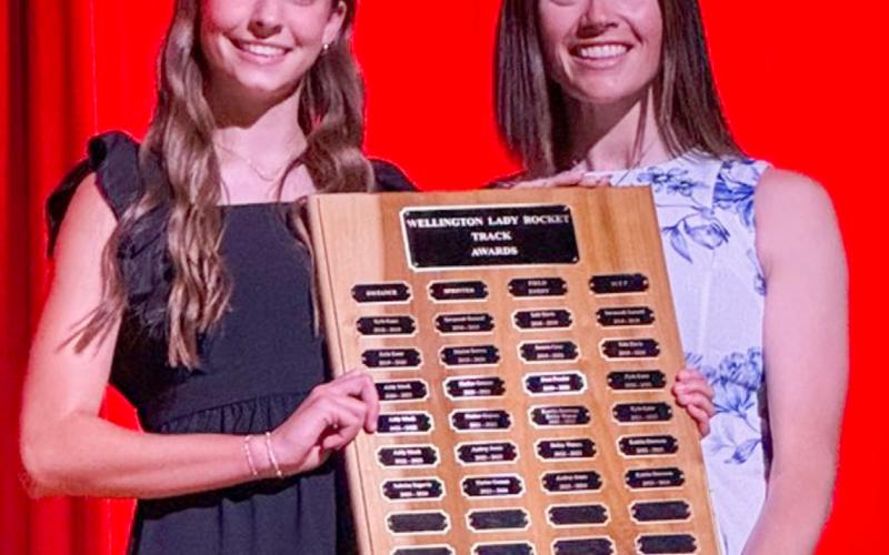 During the 6:30 p.m. Monday, May 11 Wellington High School (WHS) All-Sports Banquet at the WHS Auditorium, students received recognition for an outstanding year of Skyrocket athletics. Wellington High School freshman Libby Chandler receives the Girls’ Track Sprinter Award, presented by Coach Courtney Head. SHAUNA SALINAS/THE GREENBELT INTREPID