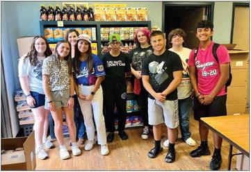 The Childress High School Family and Consumer Sciences (FCS) class stocks the Backpack Program’s shelves Thursday, Sept. 1. Spearheaded by the Childress Women’s League, the Backpack Program aids local families, providing them with a weekly backpack, which contains enough food to feed the entire family for a weekend. Photo Courtesy of Childress High School