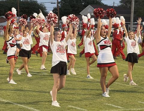 Mini cheerleaders perform at halftime