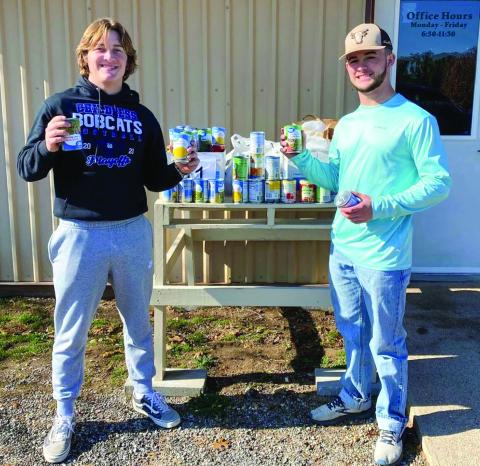 Childress High School (CHS) students Reid Felton and Nick McMinn deliver canned food drive contributions to Childress Meals on Wheels. The donations were collected through CHS student council’s canned food drive competition, which was won by the sophomore class, which will be rewarded with a movie at the Palace Theater. Childress High School thanks United Supermarkets and United Supermarkets Manager Justin Pierce for their donations. Photo Courtesy of Childress High School