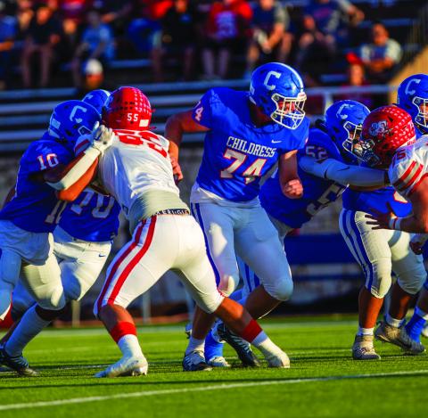 Childress’ Isaiah Jalomo (10), Caleb Mayden (70), Ethan Ferguson (74) and Juan Gonzalez (52) hold the No. 2 Holliday Eagles offensive line during the 28-14 matchup Friday, Sept. 16 at Fair Park Stadium. The Red River Sun/Nicole Dill