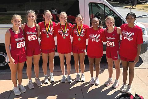 The Wellington Lady Rocket cross country team, including Ava Kate Inman, Anna Henard, Kaesyn Kane, Taytum Kane, Claire Kane, Aleah Lewis, Halle Hedrick, and Priscilla Marentes, garners second place at Guthrie’s Rattlesnake run on Wednesday, Sept. 9. WELLINGTON HIGH SCHOOL