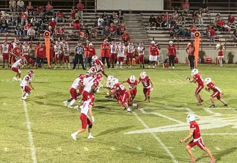 Wellington quarterback Callen Kane receives the ball and completes the pass, amassing 240 yards passing during the Skyrockets’ 48-28 homecoming win against Friona Friday, Sept. 12 at Powell Field in Wellington. 