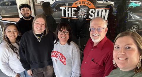 Red River Sun employees Shauna Salinas and Synghyn Beasley-Vasquez with Managing Editor Elizabeth Tanner, Clarendon Enterprise Advertising Manager Tara Allred, and new owners Roger and Ashlee Estlack.