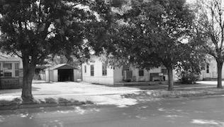 Jim Leggitt’s childhood home, located at 1106 West Ave., is pictured as it stands in August 2003. A walnut tree stood at the back corner of the property, near the garage. The front trees were yet to be planted, and the roof had previously been flat. 