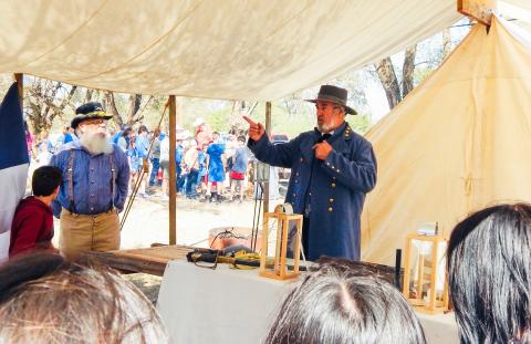 Assisted by organizer Darrell Colson, Steven Boone, reenacting Confederate General Robert E. Lee, explains life during the American Civil War to area students during the 2024 Living History Weekend at Powell Park in Wellington. Hosted by the Sons of Confederate Veterans Charles Goodnight Frontier Reg. Camp #2280, the 2025 event will again take place Friday-Saturday, Oct. 3-4 at Wellington’s Powell Park on Hwy 83. The Red River Sun/Bev Odom