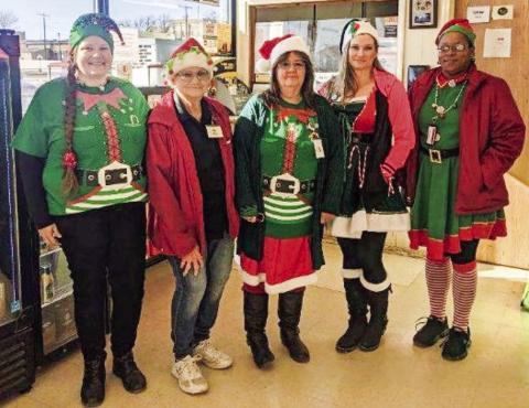 Market Square Supermarkets’ Angela Petree, left, Winnie Black, Velvet Burkenbine, Toni DeHerrera and Angie McDanel appear as Santa’s elves for Christmas Eve. The staff appreciates so many customers shopping local for a record sales day even with a 6 p.m. closing. The Wellington store closed Sunday, Dec. 25 so employees could spend time with family and friends. Courtesy Photo