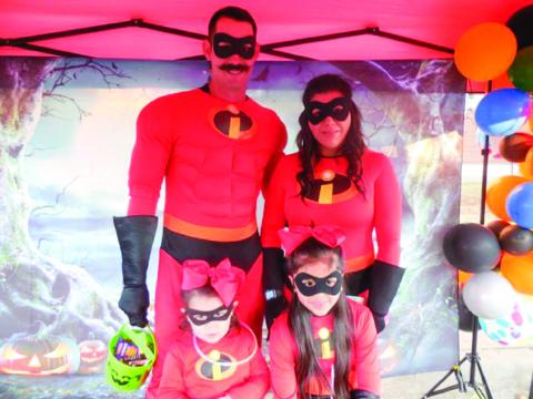 Kevin Long, dressed as Mr. Incredible, along with wife Monica Long and their daughters, Kobi and Kelbi, win the adult male category, earning $50. Photos by Memphis Chamber of Commerce
