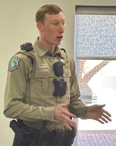 Texas Game Warden for Childress and Hall Counties Zach Fisher explains his responsibilities to the Collingsworth County Retired School Personnel. Fisher has taken nine twoweek shifts, serving as law enforcement patrolling the Texas border.