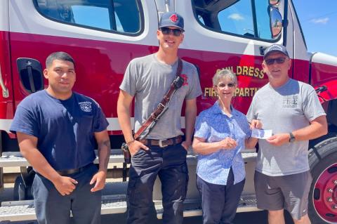 Modern Home Club’s Linda Gooch presents a donation to the Childress Fire Department. From left: Childress Fire Department firefighters Julio Olivares and Sean Curtis, Gooch, Childress Fire Department Chief Ralph Freeman. MODERN HOME CLUB