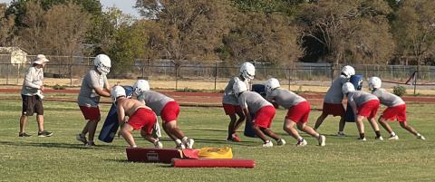 Ranked #10 in Dave Campbell Texas Football High School Ranking, Coach Joe Jones directs the Wellington Skyrocket offensive and defensive linemen during opening week workouts on Tuesday morning, Aug. 4, zooming headlong into the 2026 season. INTREPID PHOTO / BEV ODOM