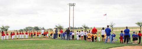 Wellington Little League teams turn toward the American flag for the Star-Spangled Banner during Opening Day ceremonies at 10 a.m. Saturday, April 10 at Marion Airpark Baseball Field. Parents, friends and baseball fans packed the park to get a glimpse of the players.