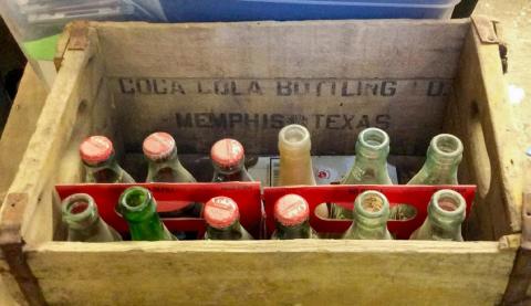 A wooden crate, from the Memphis Coca-Cola Bottling Company, which reads, “Coca-Cola Bottling Co., Memphis, Texas.” Photos Courtesy of the Collection of John R. Ballew