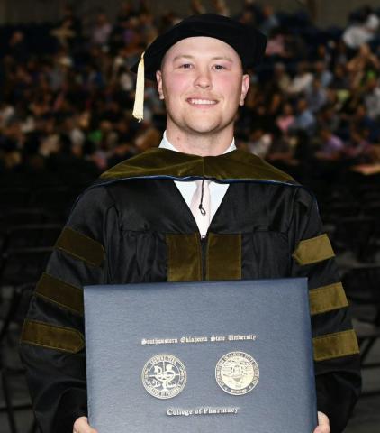 Cory Bodine, of Quanah, accepts his Doctor of Pharmacy Degree from Southwestern Oklahoma State University. Courtesy Photo