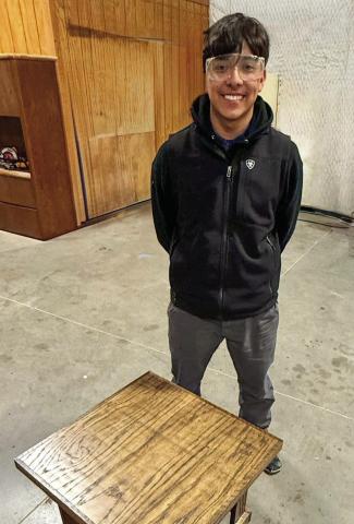Memphis Middle School first-year woodworking student Steven Saucedo-Castillo creates a solid-oak end table. Finished in Jacobean stain and coated with clear satin, Saucedo-Castillo designed and built the table himself, according to Memphis Independent School District (ISD) woodworking instructor Ramiro Salaz. Memphis ISD