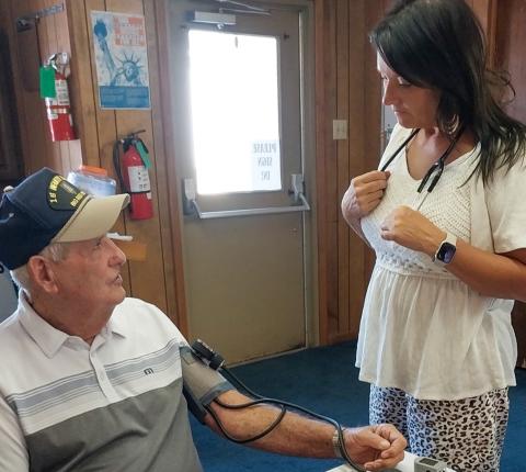 Ken McLendon receives a blood pressure check from Angels Care Home Health Account Executive Melissa Conner prior to the Thursday, June 19 luncheon at the Childress Senior Citizens Center. Angels Care Home Health makes regular visits to the center to administer blood pressure checks to luncheon attendees, who often stay for a game or two of dominoes following the meal. Grace Holman