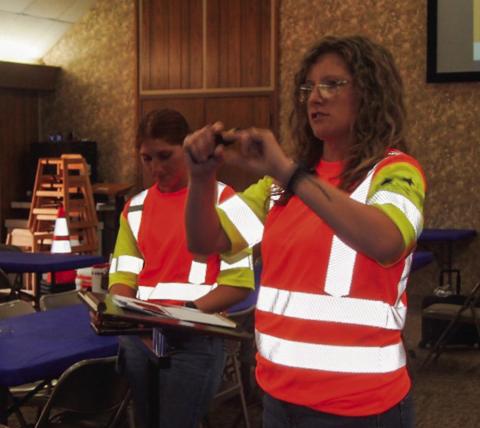 Texas Department of Transportation (TxDOT) Childress District Traffic Safety Specialist Nicole Tyler, accompanied by TxDOT Childress District Business Operations Support Technician summer intern Chloe Teichelman, left, presents a program on distracted driving at the August Adult Fellowship Luncheon at Childress Methodist Church. Examples of distracted driving, with tips to alleviate distractions, were presented. Photos by Grace Holman