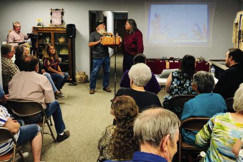 Darrell Colson, 1st Lt. Commander of the Sons of Confederate Veterans (SCV), Charles Goodnight Frontier Reg. Camp 2280, presents Lance Tahmahkera, great-great-grandson of Quanah Parker, with a “local” basket of appreciation for his visit to Wellington following his 6 p.m. Friday, Oct. 4 Comanche story time at Collingsworth County Museum. The Red River Sun/Bev Odom
