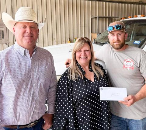 The 100 Club of the Texas Panhandle Executive Director Suzanne Talley delivers a $10,000 check to Samnorwood Volunteer Fire Department (SVFD). From left: SVFD Fire Chief Larry Wright, Talley, SVFD First Assistant Fire Chief Matt Tarver. COURTESY PHOTOS