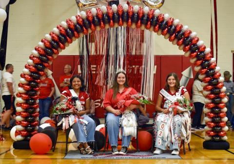 Rocket Regiment senior Bailey Steagall, center, accepts the honor of Band Queen during the Sept. 13 homecoming pep rally festivities in the Wellington High School gymnasium. First runner-up Jasmin Moreno, left; and second runner-up Eryn Torrez, right, complete the Rocket Regiment Homecoming Court. Junior Rocket Regiment boys served as escorts for the royalty. Back row, from left: Jacob Lee, Sawyer Smith, Christopher Reyes, Alladin Rodriguez, Kris Valdez. Wellington High School