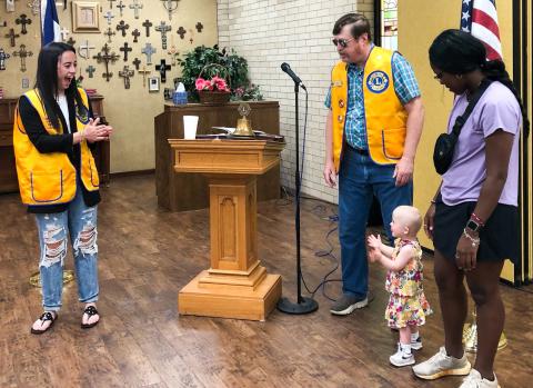 Wellington Lions Sweetheart Summer Owens, 18, and guest Kaydence Mixon, 2, with Lion Jayla Kilgore, celebrate June birthdays as Lion Jeff Pastor leads in singing “Happy Birthday” to open the June 19 meeting. The Red River Sun/Bev Odom