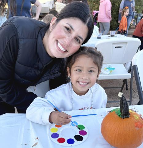 Taylor and Sofia Vitela enjoy the pumpkin painting at the museum during the annual Rocktober event in downtown Childress Saturday evening, Oct. 17. INTREPID PHOTO / AARON RAMOS