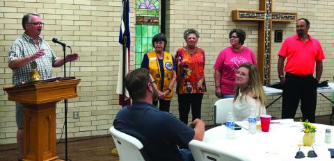 Lion Neal Odom, left, leads in singing “Happy Birthday” to Nita Day, Fraya Hammons, Lori Moore and Gene Pena during the Sept. 19 meeting with guests Brandon Powers and Nicole Tyler. The Red River Sun/Bev Odom