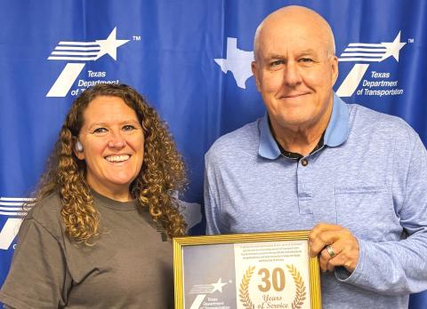 One of 10 recipients, Shari Thomason, Childress District Lab, is presented a 30-year service award by Childress District of the Texas Department of Transportation Engineer Darwin Lankford Thursday, May 21. “I appreciate the dedication each of these employees has given not only to the district, but to the state of Texas,” Lankford said. TEXAS DEPARTMENT OF TRANSPORTATION
