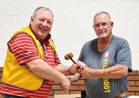 Memphis Lions Club outgoing President Dickie Cloyd, right, passes the gavel back to 2026-2027 President Daniel Downey, who has previously served as the club’s president. Dickie was presented with a plaque of appreciation for his service.