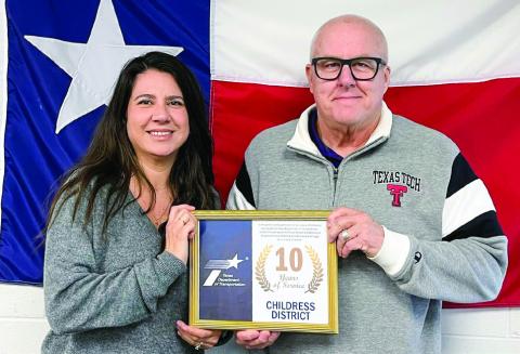 Childress District of the Texas Department of Transportation’s (TxDOT) Annabel Jurado, left, accepts an award for 10 years of service from TXDOT Childress District Engineer Darwin Lankford. Photos Courtesy of TxDOT Childress District