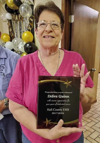 Hall County Emergency Medical Services (EMS) thanks Debra Guinn for seven years of service during a Retirement Party honoring Guinn Thursday, Sept. 12 at the First Bank and Trust Bronze Room in Memphis. “For seven years, Debra saved many lives and served Memphis with great skill,” Memphis Chamber of Commerce Manager Kim Cloyd said. “We wish her the best.” Photo Courtesy of Memphis Chamber of Commerce