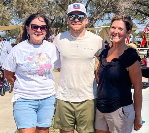 Wellington State Bank, represented by Odilia Cantu, left, Rowdy Duncan and Veronica Gray, receive first place in the Fifth Annual Rocky Sprott Living History Chili Cookoff. Sons of Confederate Veterans