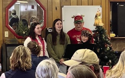 Monson Music Studio students Libby Sanford, Saylee Ochoa and Bella Blu Sanders, accompanied by Monson Music Studio instructor Gerald Monson, perform at the Childress Senior Citizens Center’s Christmas Luncheon Thursday, Dec. 19. Courtesy Photos
