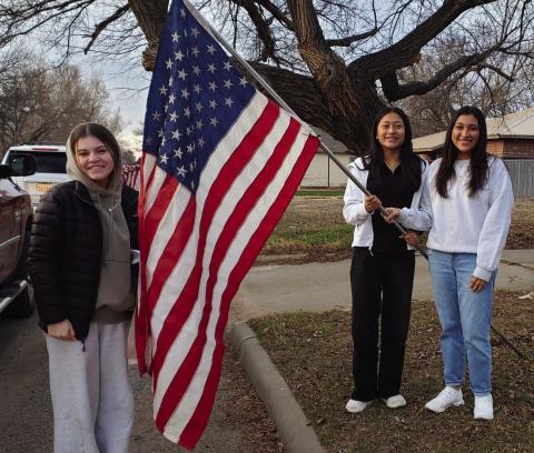 Leo Club officers, including, from left, Vice President Currie Forrester, Secretary Leslie Rodriguez and President Christell Melendez, assist Collingsworth County Chamber of Commerce with placing American flags across Wellington Monday, Feb. 17 for President’s Day. “I love their willingness to help out and volunteer when needed!” said Noemi Pena, one of four Leo Club Advisors for Wellington Lions Club. Photo Courtesy of Wellington Lions Club