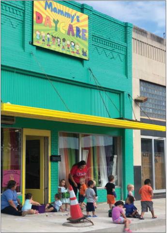 The Red River Sun/Bev Odom Owner Mandy Rodriguez and her Mammy’s Daycare crew breathe in some outdoor, morning air before the temperatures rose Tuesday, Aug. 16. Her new facade and sign add a bright spot to the west side of the Collingsworth County Courthouse Square.