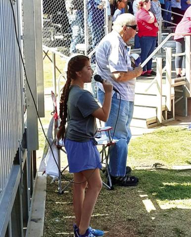 Monson Music’s Bella Blu Sanders performs at softball game