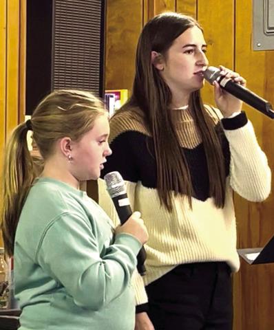 Monson Music Studio students Kinzlee Willis, left, and Saylee Ochoa perform at the Childress Senior Citizens Center luncheon Thursday, Oct. 30, singing five spooky selections just in time for Halloween. Ochoa sang “Spooky, Scary Skeletons,” accompanied by Monson Music Studio owner and instructor Gerald Monson, while Willis sang “The Purple People Eater.” Together, the duo performed “Ghostbusters,” “The Addams Family” and “Witch Doctor.” Courtesy Photo
