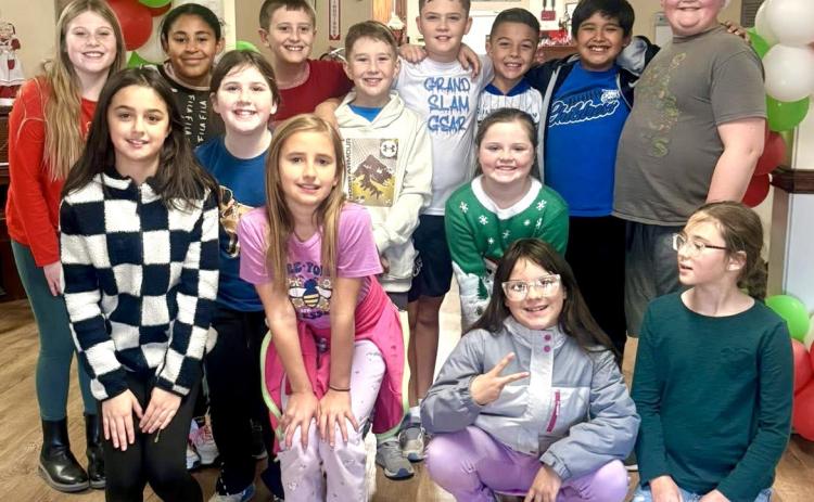 Childress Elementary School fourth-grade students spread holiday cheer at Childress Healthcare Center Thursday, Dec. 18, singing to and visiting with residents. Following the excursion, students traveled to Fair Park, where they enjoyed Christmas in the Park’s lighted displays. Childress Elementary School